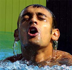 Indian swimmer Rehan Poncha reacts after winning the 200-m butterfly event at 9th SAF Games 