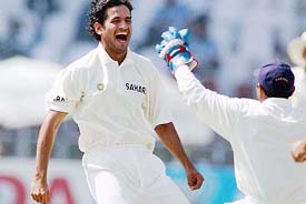 Irfan Pathan (left) celebrates with wicketkeeper Parthiv Patel