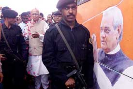 Supporters shower flower petals on Deputy Prime Minister L.K. Advani as he approaches his �Bharat Uday Yatra� rath in Ahmedabad