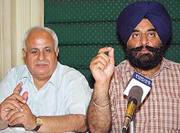 Mr Sarabjit Singh Makkar, President of the Brick-kiln Owners Association, and Mr Kuldip Khanduja address a press conference in Sector 35, Chandigarh, on Thursday. 