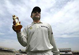 Man-of-the-Match Virender Sehwag poses with his trophy during the prize distribution ceremony in Multan 