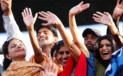 Indian cricket fans celebrate their team's victory 