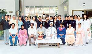 GNIMT players with the PTU overall general sports championship trophy and other trophies. 