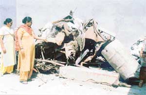 Remains of household goods which were damaged in a MIG crash in Bank Colony, Mullanpur Dhaka, last year. 