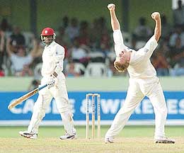 England bowler Andrew Flintoff celebrates his fifth wicket