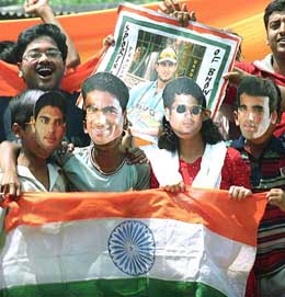 A group of cricket fans in Kolkata wearing the masks of Indian cricketers waving national tri-colour on Friday to celebrate the Indian victory over Pakistan in first Test in Multan.