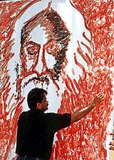 Indian artist Shihan Husaini paints a portrait of Noble Prize winner Rabindranath Tagore