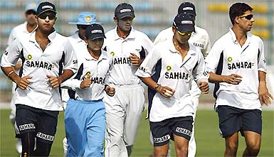Indian players jog during a training session in Lahore on Saturday