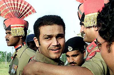 Virender Sehwag poses with BSF jawans