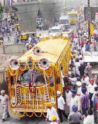 A flower bedecked bus carrying the holy Guru Granth Sahib during the chetna march in Ludhiana