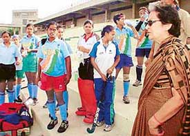 Vidya Stokes, President of the Indian Women's Hockey Federation, with the hockey team at Sector 42 hockey stadium, Chandigarh
