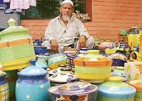 A craftsman displays his Khurja pottery at Karigari Craft Bazar on the premises of Lajpat Rai Bhavan in Sector 15, Chandigarh, on Monday. 