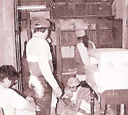Volunteers help clean up the Institute after members of the Sambhaji Brigade destroyed invaluable books and artefacts 