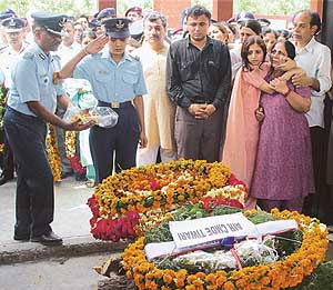 Family members of Flt Lt Gagan Oberoi and Air Force personnel pay tributes to him at a cremation ground in Ambala Cantonment on Monday. 
