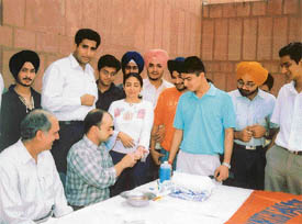 Students of law college get their blood tested to prepare a blood directory at a function organised at Law College