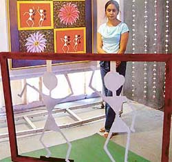 A student of final year (Painting) with her creation on display at Government College of Art Gallery, Sector 10, Chandigarh