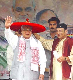 Prime Minister Atal Bihari Vajpayee wears a traditional Assamese �japee� presented to him by the BJP candidate for the Guwahati Lok Sabha seat, Bhupen Hazarika