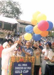 Delhi Sikh Gurdwara Management Committee president Prehlad Singh Chandkhok and Lt-Governor Vijai Kapoor release balloons to signal the inauguration of the Ajit Singh Hockey Tournament at the Shivaji Stadium on Tuesday.