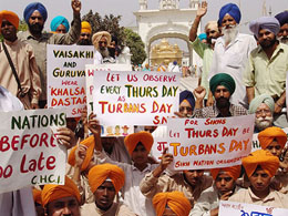 Activists of the Sikh Nation Organisation hold a demonstration in front of the SGPC office in Amritsar on Tuesday to seek UN intervention on the turban issue in France.