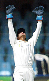 Parthiv Patel successfully appeals for a caught-behind decision against Imran Farhat 