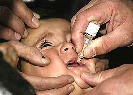 A child receives a polio drop at a hospital in Kabul on Tuesday