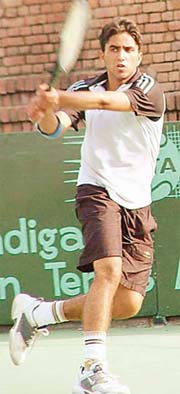 Izreek Singh Randhawa of Chandigarh in action during the first round of the main draw of the AITA Super Series Tennis Meet being held at CLTA stadium, Chandigarh