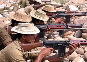 CRPF personnel aim their rifles during an exercise in Jammu on Wednesday. CRPF officials said they were training their personnel to deal with any attack by terrorists during the Lok Sabha poll. 