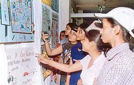 Students of Christian Medical College view posters on road safety as they observe World Health Day in Ludhiana