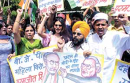  Supporters of the Congress raising slogans against Gujarat Chief Minister Narendra Modi and the Bharatiya Janata Party (BJP) during a demonstration at Jantar Mantar in the Capital on Wednesday.