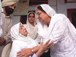 Punjab Deputy Chief Minister Rajinder Kaur Bhattal offers her condolences to Ms Joginder Kaur, widow of Gurcharan Singh Tohra, in Tohra village in Patiala district, on Wednesday.