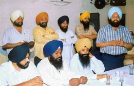 Koom Kalan MLA Inder Iqbal Singh Atwal makes a point while SAD-BJP Lok Sabha candidate from Ludhiana Sharanjit Singh Dhillon looks on at a press conference