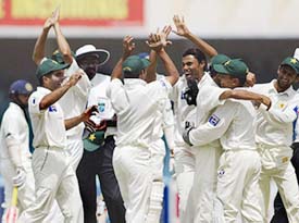 Pakistan players celebrate the dismissal of Anil Kumble on the fourth day of the second Test against India