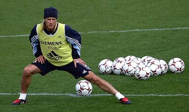 Real Madrid's British midfielder David Beckham stretches during a training session in Madrid on Thursday. �Posh Spice� Victoria Beckham insisted on Tuesday