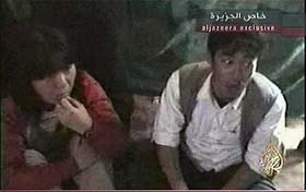 A video grab from Al-Jazeera shows two of the three Japanese citizens