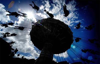 People enjoy a twirling swing ride at the Royal Easter show in Sydney