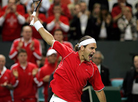 Swiss world No 1 Roger Federer celebrates his victory over French Nicolas Escude in their Davis Cup World Group quarterfinal match in Lausanne
