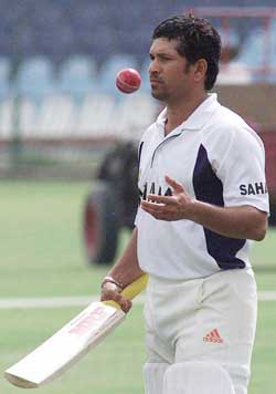 Star batsman Sachin Tendulkar practises with a bat and ball during a practice session in Lahore