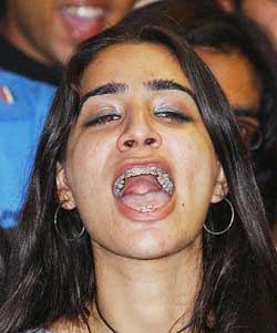 A student of Lahore University of Management Sciences shouts for Indian pacer Laxmipati Balaji