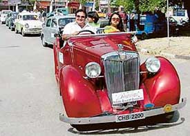 A cavalcade of vintage and classic cars passing through roads in Chandigarh
