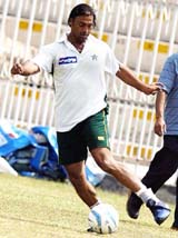 Pakistani speedster Shoaib Akhtar plays football during a practice session 