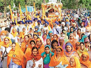 Devotees take part in a nagar kirtan on the eve of Baisakhi in Chandigarh on Monday.