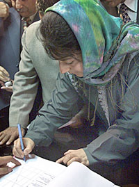 Ms Mehbooba Mufti, president of the People�s Democratic Party, signs her nomination papers in Anantnag on Monday.