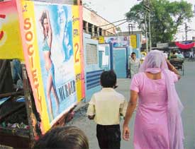 An obscene poster on a rickshaw despite a warning by the Deputy Commissioner banning such kind of posters