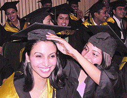 A student adjusting the cap of her collegemate during the 46th Convocation of the Maulana Azad Medical College and Associated Hospitals at a function in the Capital on Monday.