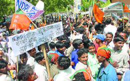 BJP activists protesting against the NDPL at Vijay Nagar area for the power crisis in the Capital on Monday.