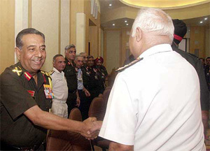 Army chief General N. C. Vij shakes hands with senior defence personnel before the Army Commanders' conference in New Delhi