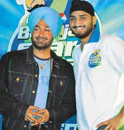 Punjabi singer Malkit Singh and cricketer Harbhajan Singh are all smiles during a press conference