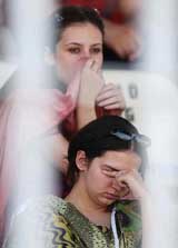 Pakistani cricket fans wear a sad look on their faces after the home team suffered a batting debacle 
