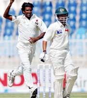 Laxmipathy Balaji celebrates the dismissal of Kamran Akmal