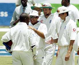 England cricketers congratulate Brian Lara after the latter went past Matthew Hayden's world record score of 380 in Antigua 